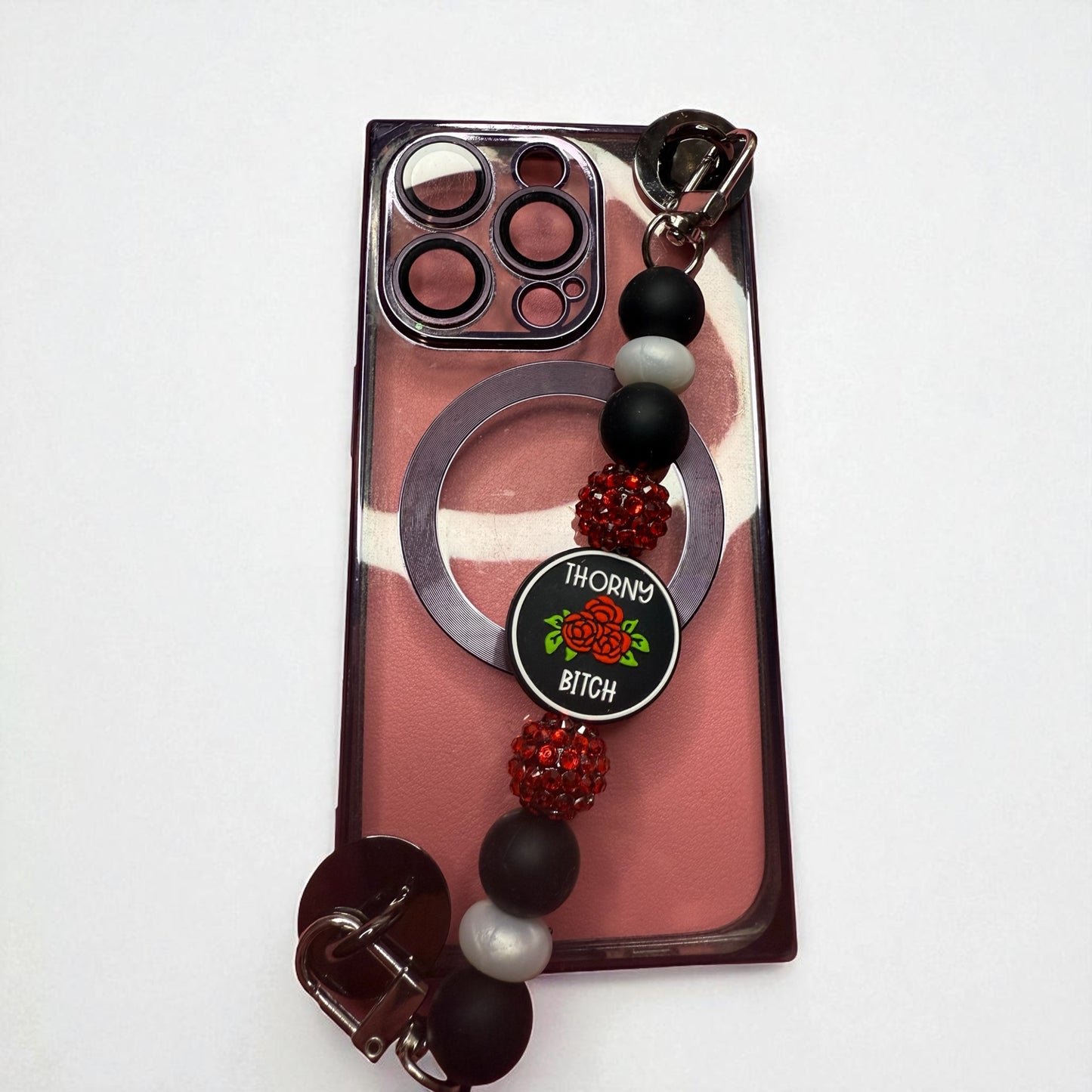 Phone charm chains with adhesive backing